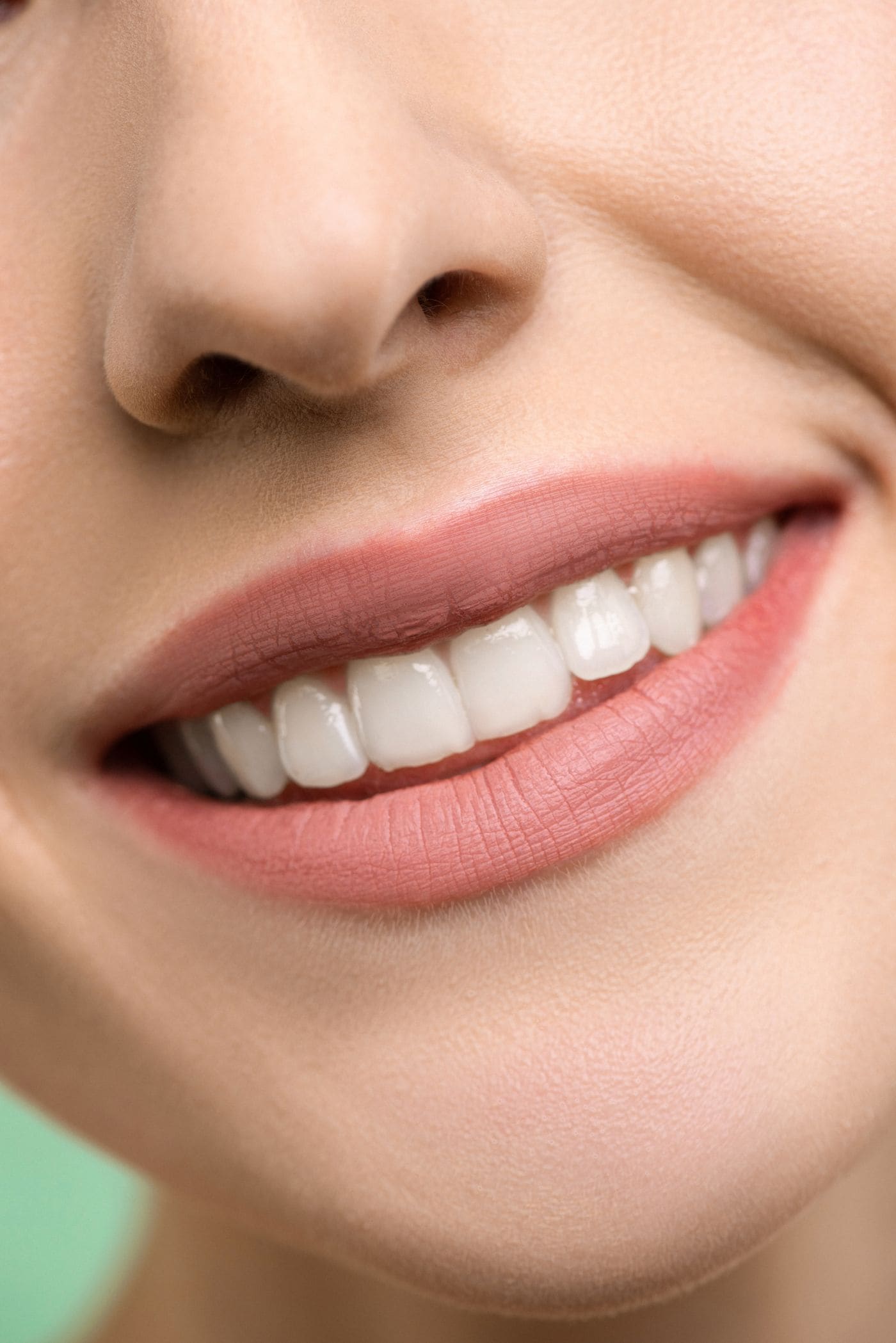 Close-up of a woman smiling with healthy white teeth