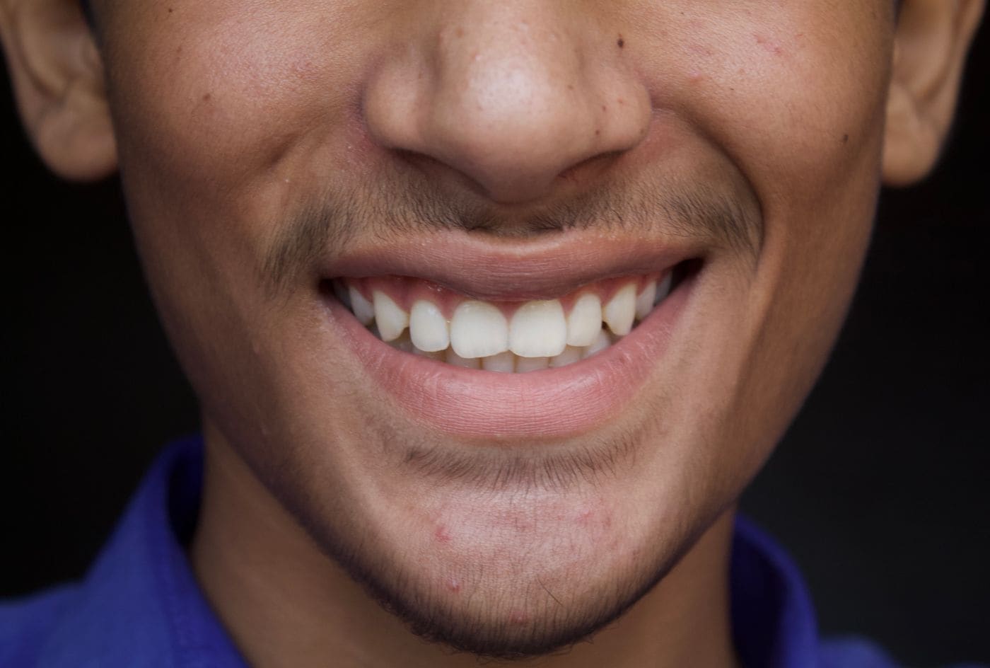 Close-up of a young man smiling