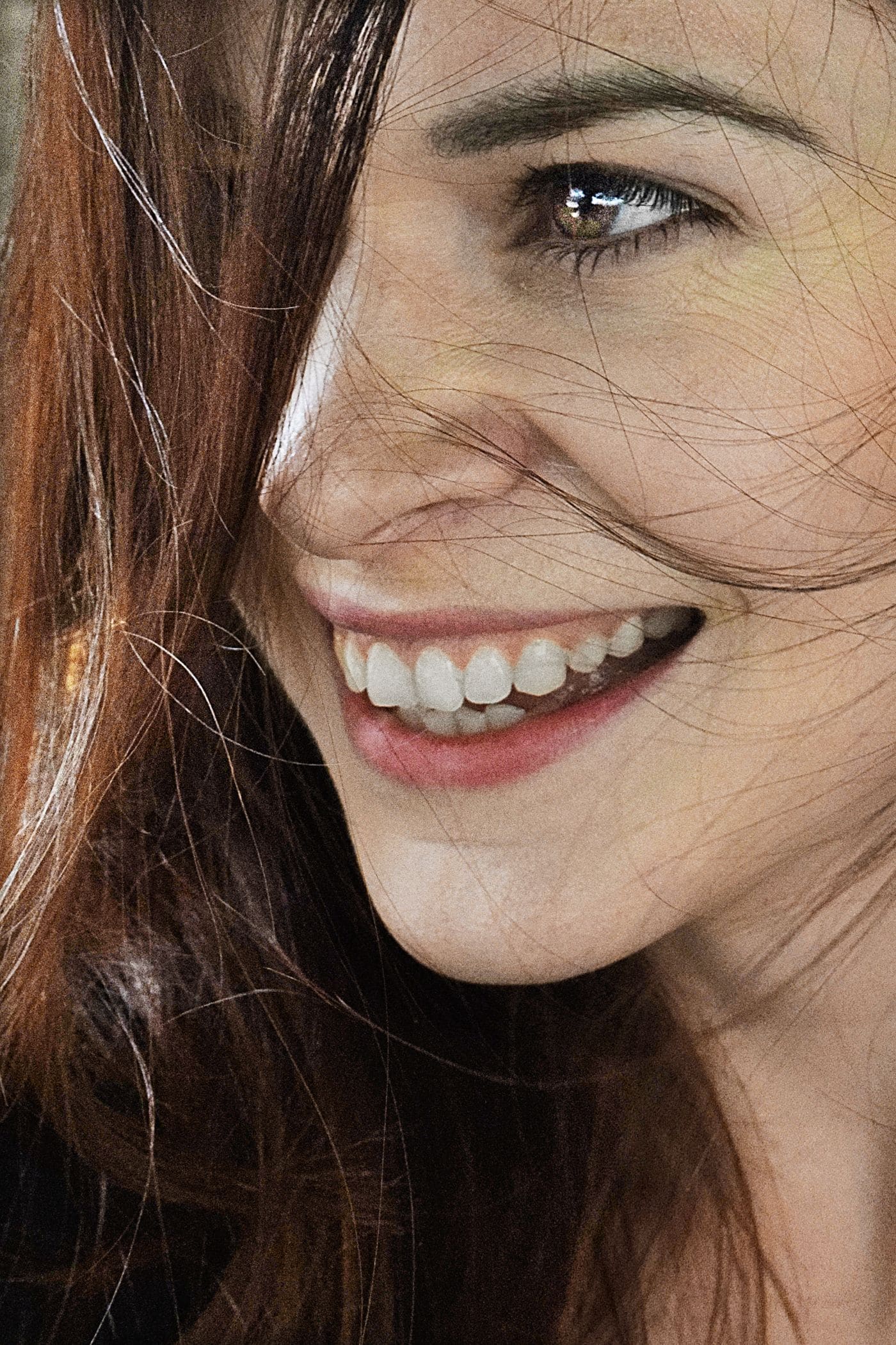 A smiling woman with brown hair
