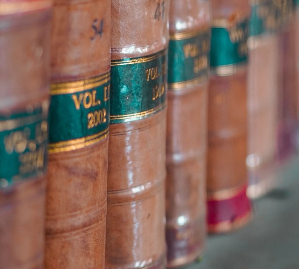 Leather-bound law reports on a shelf