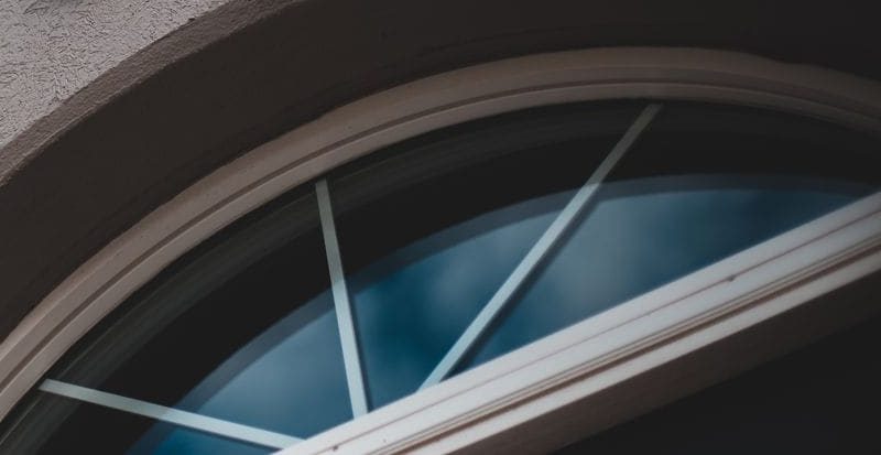 The arched fanlight over the entrance to the building