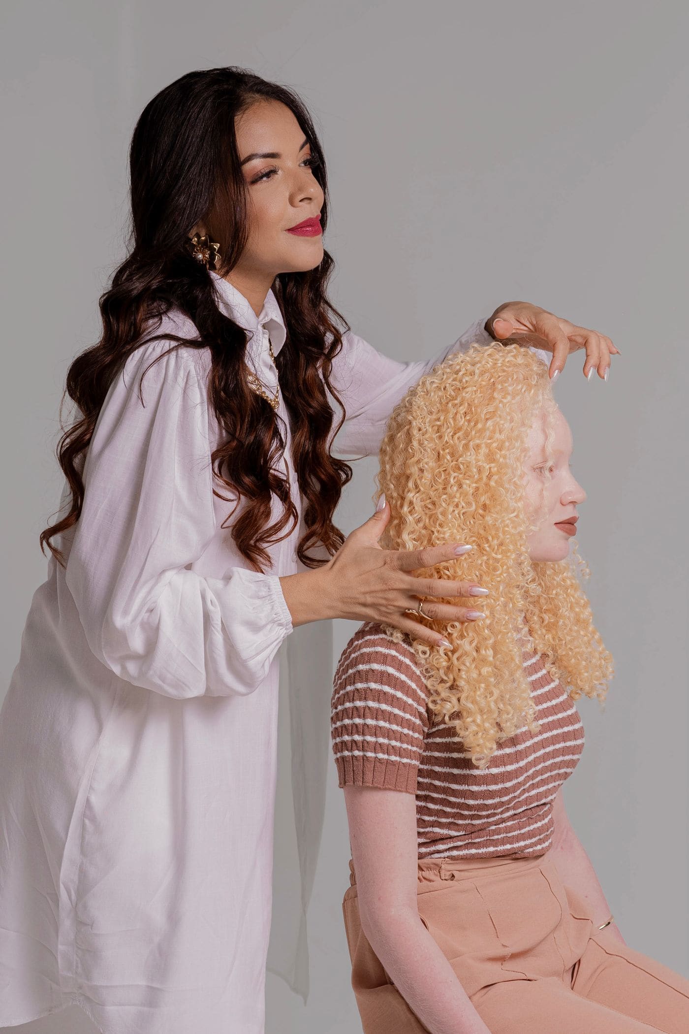 Stylist working on a client's curly hair