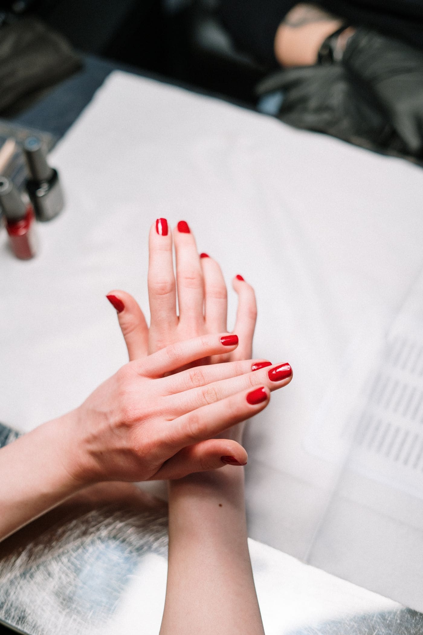 Red manicure at the nail bar