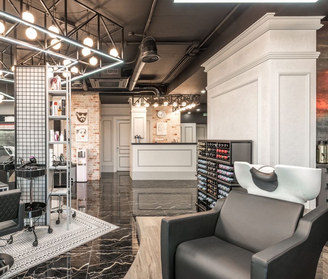 A backwash chair beside the product shelves