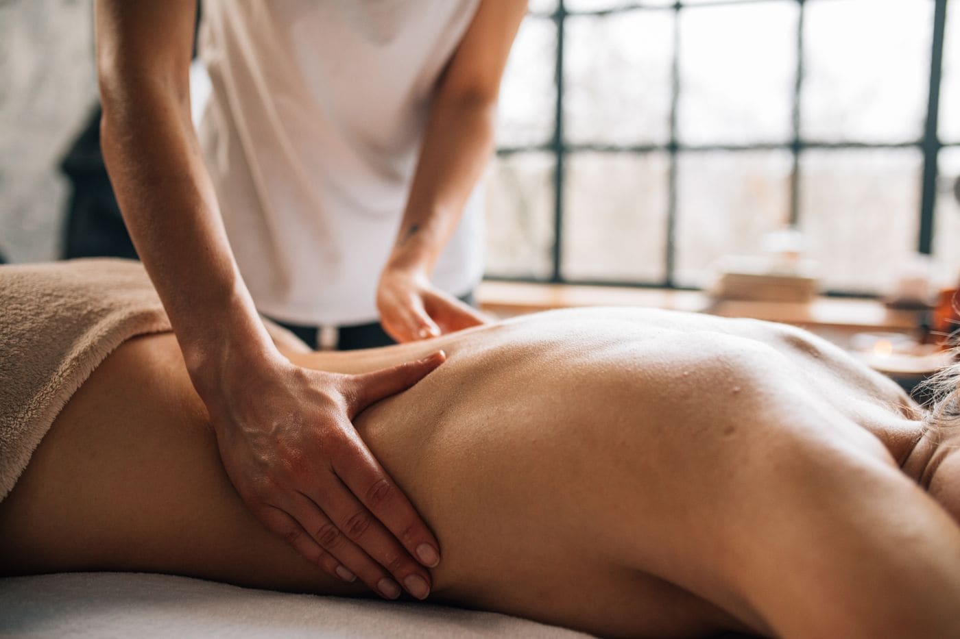 Massage on the spa floor in soft daylight